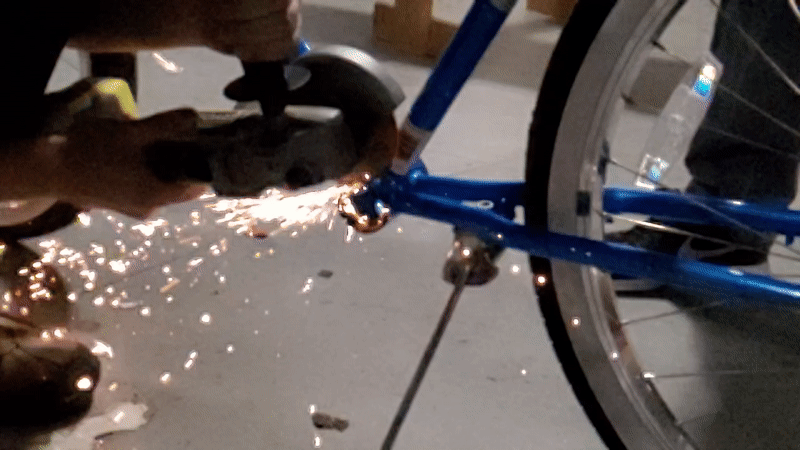 Grinding the hub of the prototype to fit the drive motor